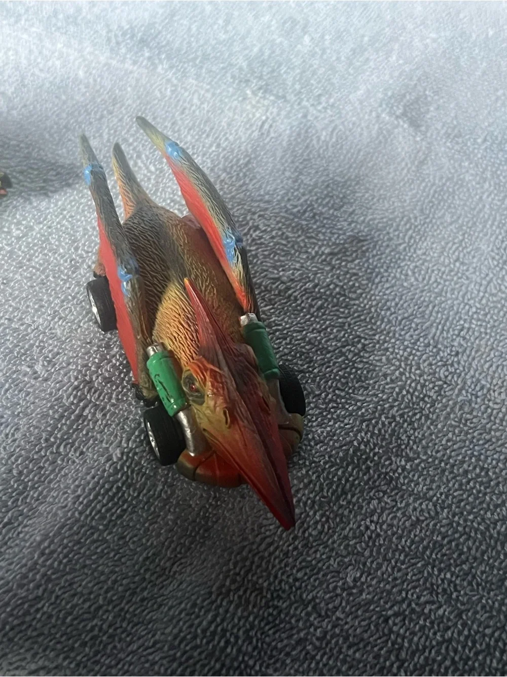 Two dinosaur pull-back toy cars